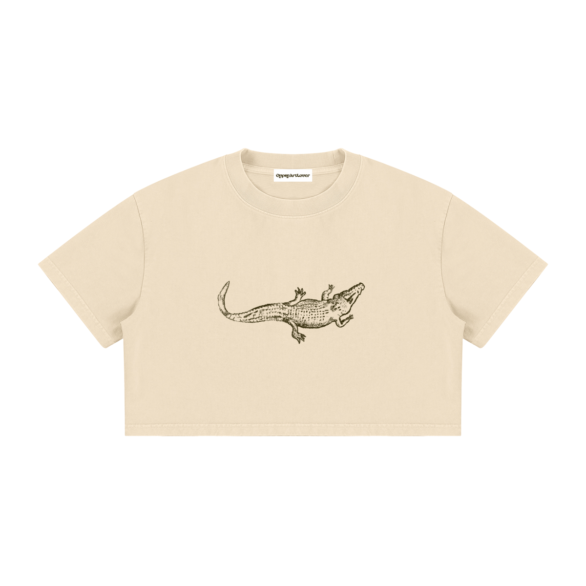 Close-up of the alligator graphic on the Apricot Mineral Wash Crop T-Shirt.