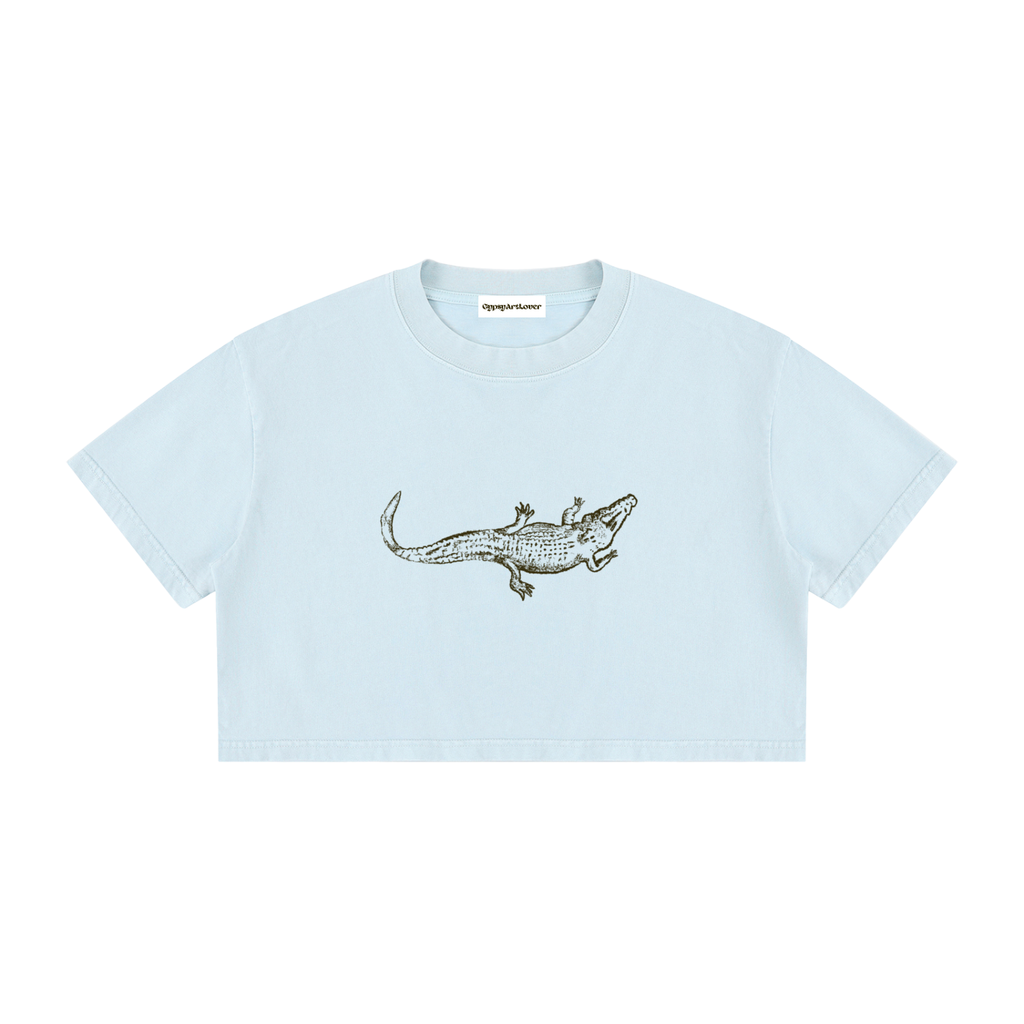 Close-up of the alligator graphic on the Light Blue Mineral Wash Crop T-Shirt.